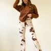 Bailey Rose Never Settle Cow Print Pants Featured