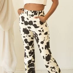 Emory Park Featured Here Now Cow Print Flare Jeans